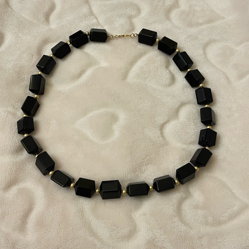 Elegant vintage-style necklace faceted black bead paired 14K gold accents